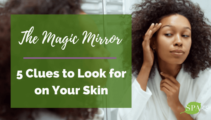 Woman looking at her skin the magic mirror